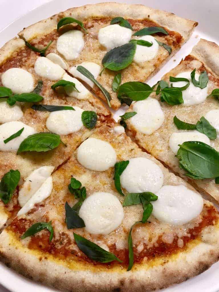 make pizza at home, rather than restaurant delivery