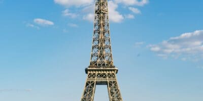 The Eiffel Tower under a blue sky in Paris.